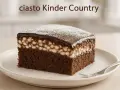 Pyszne ciasto Kinder Country z czekoladowym biszkoptem, kremem i polewą. Idealne na deser!